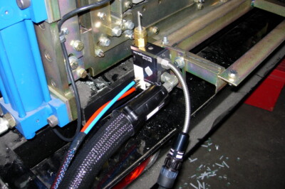 A closeup image of a snap seam nozzle on a rollformer.